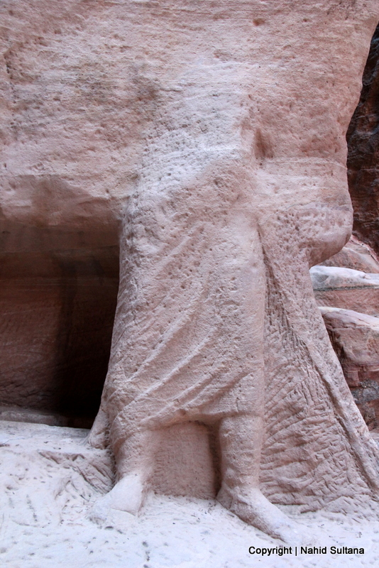 A 2000 years old statue carved from stone by Nabataean inside Siq in Petra, Jordan