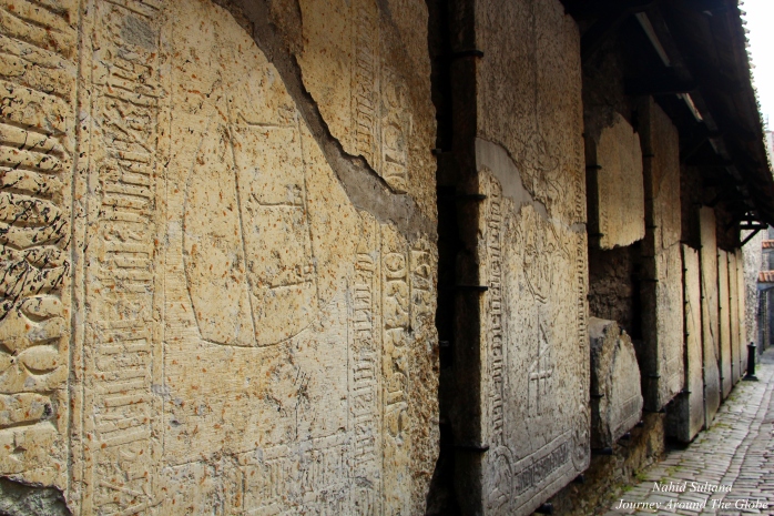 Medieval tombstones on the walls of St. Catherine's Passage in Tallinn, Estonia