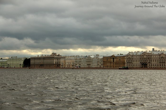 A line of historic palaces and old buildings by Neva River in St. Petersburg